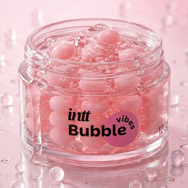 Intt Bubble Vibes caixa amarela e rosa com pote aberto mostrando as esferas em gel